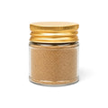 Black summer truffle powder (Tuber aestivum) in a clear glass jar with a yellow lid