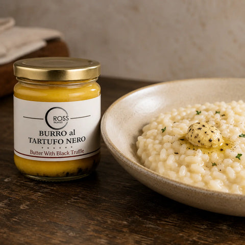 Black truffle butter with Tuber aestivum melting into warm creamy risotto