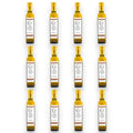Set de botellas de aceite de oliva virgen extra con trufa negra, tapas doradas y etiquetas blancas