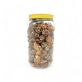 Morchella Esculenta secas en un frasco de vidrio transparente con tapa amarilla para cocina gourmet