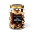 Dried porcini mushrooms (Boletus edulis) in a clear glass jar
