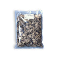 Cornflakes de color carbón en bolsa transparente con etiqueta blanca, ideales con trufa negra seca de verano
