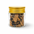 Dried Tuber aestivum summer truffle slices in a clear glass jar with a yellow lid