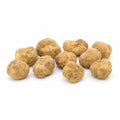 Trufas blancas frescas Tuber magnatum de tamaño mediano con superficies ocre pálido y variación natural en la forma  