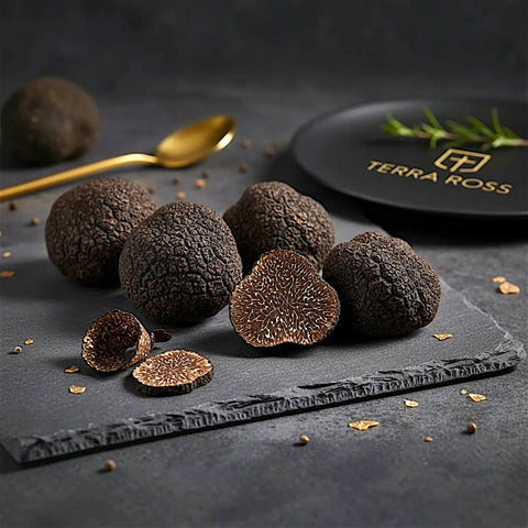 Fresh Tuber melanosporum A Grade truffles showing the dark marbled interior