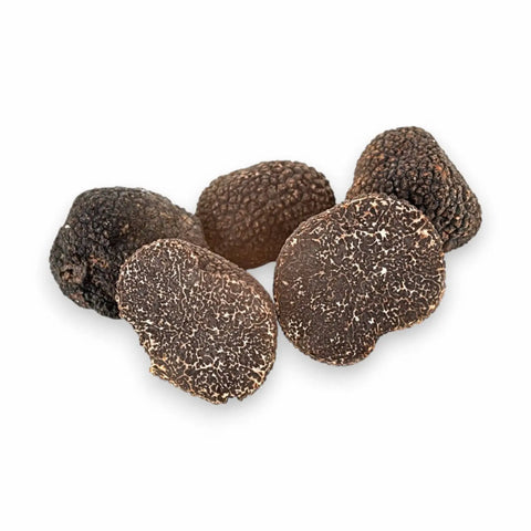 Fresh Tuber melanosporum B Grade prepared for grating into a warm pasta dish