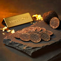 Thin fresh Tuber melanosporum slices showing natural marbling and shape variation