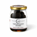 Whole Tuber aestivum summer truffles preserved in brine in a glass jar
